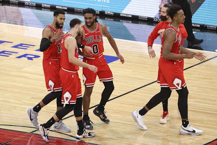 Chicago Bulls guard Garrett Temple (17) and guard Zach LaVine (8) and guard Coby White (0) walk off the court during a time out